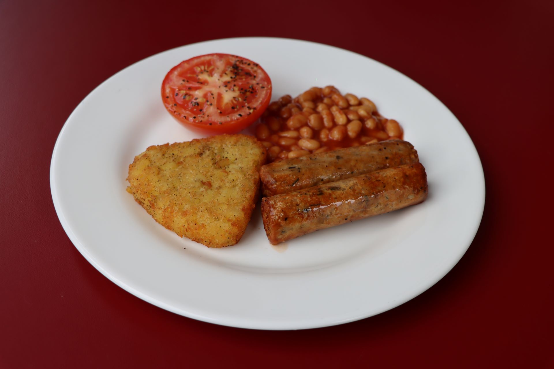Vegetarian Brunch: Quorn Sausage, Hash Brown, Tomato and Beans